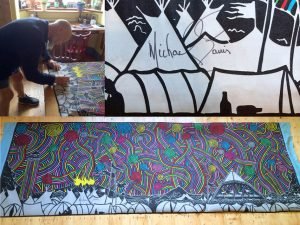 Michael Eavis signs the tapestry